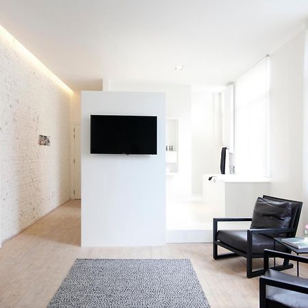 Maison Nationale City Flats & Suites Antwerpen Ruang foto A room at the hotel