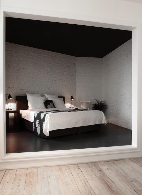 Maison Nationale City Flats & Suites Antwerpen Ruang foto A bedroom