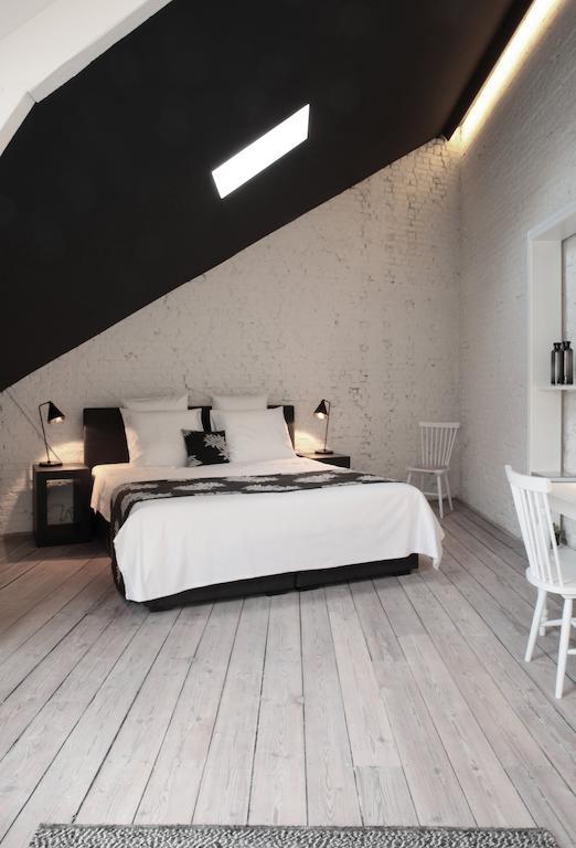 Maison Nationale City Flats & Suites Antwerpen Bagian luar foto A room at the hotel